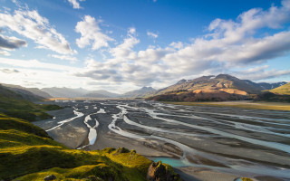 River valley mountains cloudy sky 6 - a lush green valley under a cloudy sky free wallpaper