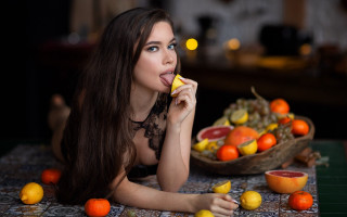 Woman eating fruit still life - transgressive art free wallpaper