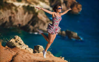 Woman jumping cliff ocean dress - canon eos r 3 free wallpaper