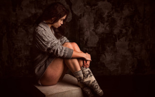 Woman sitting concrete sweater boots - a sweater free wallpaper