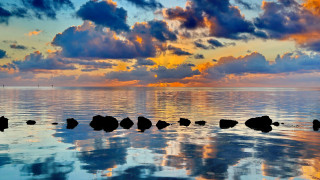 Sunset ocean rocks clouds city - a few rock free wallpaper