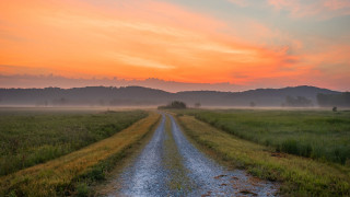Dirt road sunset field hill - a dirt road in a field free wallpaper