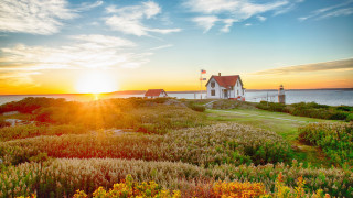 House hill sunset water landscape - a sunset in the background and a body of water free wallpaper