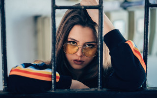 Woman glasses jail cell portrait - free vintage wallpaper