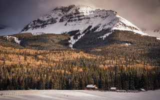 Mountain snowy forest cabin cloudy - a cloudy sky free wallpaper for desktop