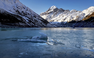 Mountain lake ice boat sky - frozen free wallpaper