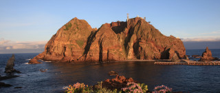 Rock lighthouse pier ocean cloudscape - murata range free wallpaper for desktop
