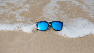 Sunglasses beach sand foam ocean - a pair of sunglasses free wallpaper