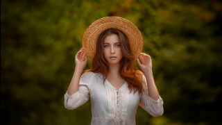 Woman strawhat field portrait blurry - a straw hat free wallpaper