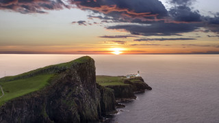 Lighthouse cliff ocean sunset clouds 2 - david begbie free wallpaper