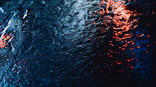 Rainy window red lights reflection - a close up of a rain free wallpaper