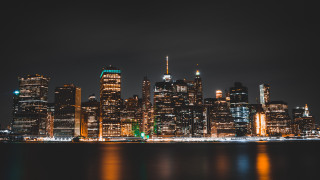 City skyline night lights river - a body of water in front free wallpaper for desktop