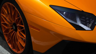 Bright orange sports car front - photorealism free wallpaper for desktop