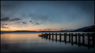 Docked lake mountains sunset cloudy - lightroom free wallpaper