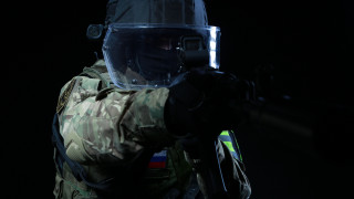 Camouflage man gun flashlight helmet 2 - his hand and a helmet free wallpaper