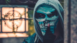 Painted face hood man cigarette - biopunk free wallpaper