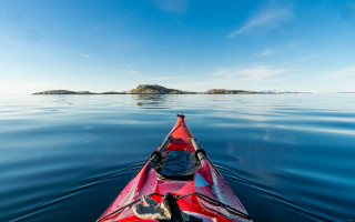 Red kayak island ocean sky - the middle of the water free wallpaper