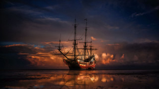 Large ship water reflection sunset - water under a cloudy sky free wallpaper