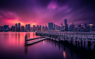 City skyline purple pink water - free city wallpaper