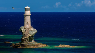 Lighthouse rock ocean bird blue - a rock in the middle of the ocean free wallpaper