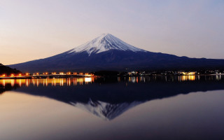 Mountain reflection city lights dusk - a city in the distance free wallpaper for desktop