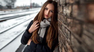 Elina karimova brick wall train - a woman leaning against a brick wall free wallpaper