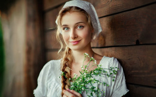 Woman white dress plant smile - a wooden wall behind her free wallpaper