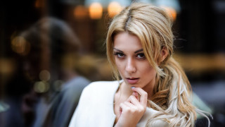 Blonde woman serious portrait bokeh 3 - free portrait wallpaper for desktop