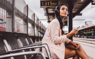 Woman sitting bench headphones phone - the train free wallpaper