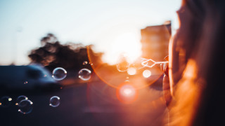 Person bubbles building sun lens - a person holding free wallpaper