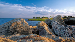 Rocky shore water mountains sky 2 - a rocky shore free wallpaper