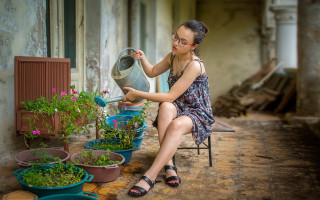 Woman sitting plant watering can - the other hand free wallpaper for desktop