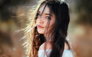 Woman longhair field blowing portrait - hair free wallpaper