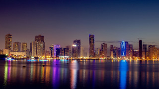 City skyline lake boat night - hurufiyya free wallpaper for desktop