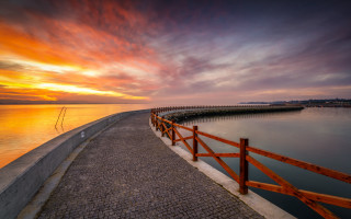 Sunset water fence pier city - a wooden fence free wallpaper