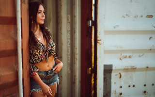 Woman jeans leaning wall knife - a knife free wallpaper