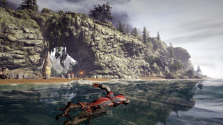 Motorcycle water mountain beach people - a rock formation free wallpaper for desktop