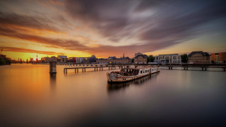 Harbor sunset boat city bridge - a city in the background and a bridge in the foreground free wallpaper