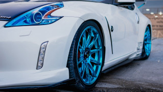 White sports car blue wheels - a white sports car free wallpaper for desktop