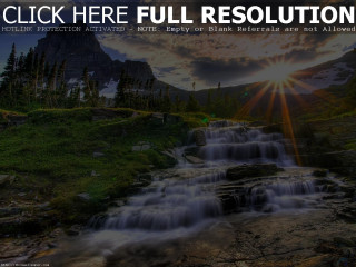 Waterfall sunshine mountain cloudy sky - a waterfall free wallpaper