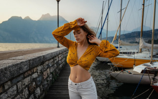 Woman yellow top dock mountains - a yellow top free wallpaper