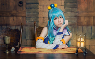 Blue hair woman candle brick - a brick wall behind her free wallpaper