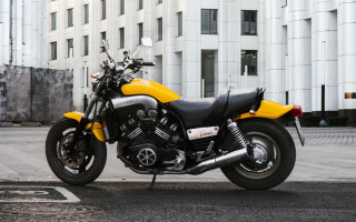 Yellow motorcycle road building futurism - anamorphic free wallpaper