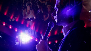 Man holding microphone crowd people - mask free wallpaper