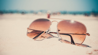 Sunglasses beach sand ocean sunset - a pair of sunglasses free wallpaper