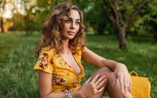 Woman grass yellow purse nature - free portrait wallpaper for desktop