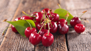 Cherry leaves wooden table food - top of them free wallpaper