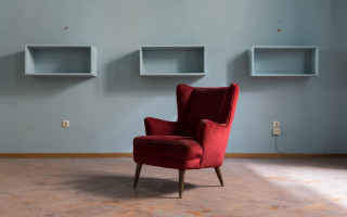Red chair liminal space shelves - a red chair free wallpaper