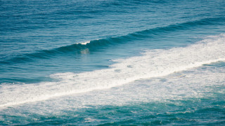 Surfing wave ocean sky beach 2 - a sky background and a person free wallpaper