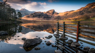 Lake fence mountains clouds rocks - photograph free wallpaper for desktop